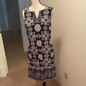 Elegant Black and White Sleeveless Dress with sequins on top and flounce hem